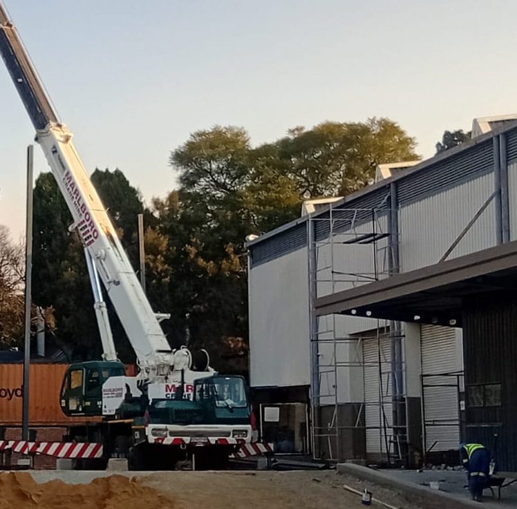 Crane lift during structural steel erection